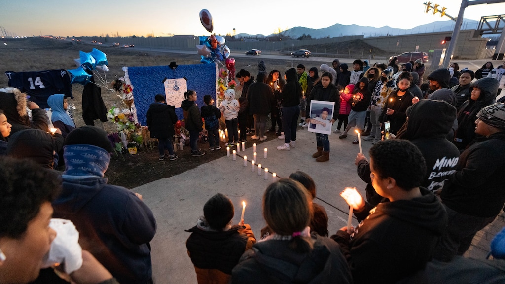 (Francisco Kjolseth | The Salt Lake Tribune) More that a hundred people gather at the candlelight vigil of Hunter High football players Paul Tahi , 15, Tivani Lopati, 14, and Ephraim Asiata, 15, on Friday, Jan 14, 2022, in West Valley City, near Hunter High School along 4100 South at Mountain View Corridor. Paul Tahi and Tivani Lopati were killed in a shooting, while Ephraim Asiata remains in critical condition.