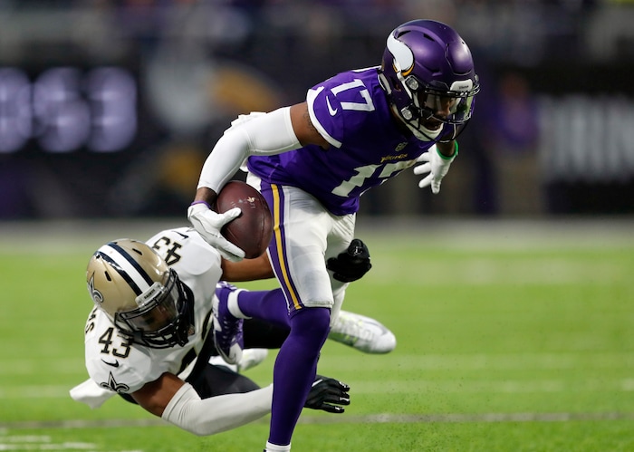 Minnesota Vikings wide receiver Jarius Wright (17) is tackled by New Orleans Saints free safety Marcus Williams (43) after a catch during the first half of an NFL divisional football playoff game in Minneapolis, Sunday, Jan. 14, 2018. (AP Photo/Charlie Neibergall)