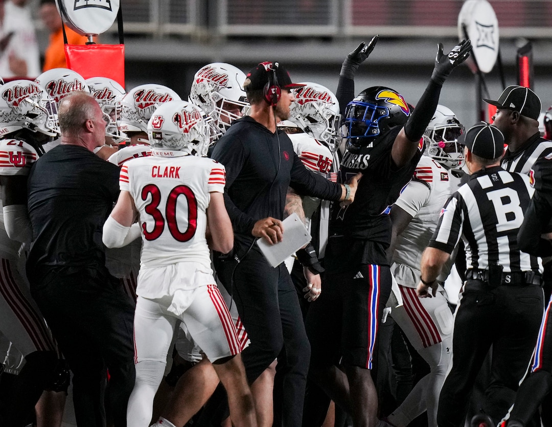 (Bethany Baker  |  The Salt Lake Tribune) Utah Utes Kansas Jayhawks gather on the sidelines following a play during the game between the Utah Utes and the Kansas Jayhawks at Rice-Eccles Stadium in Salt Lake City on Saturday, Oct. 10, 2026.