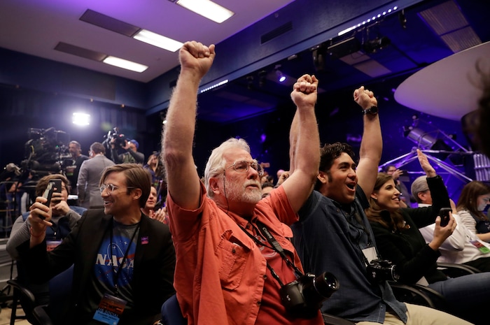 (Marcio Jose Sanchez | The Associated Press) People at NASA's Jet Propulsion Laboratory in Pasadena, Calif., celebrate as the InSight lander touches down on Mars on Monday, Nov. 26, 2018.