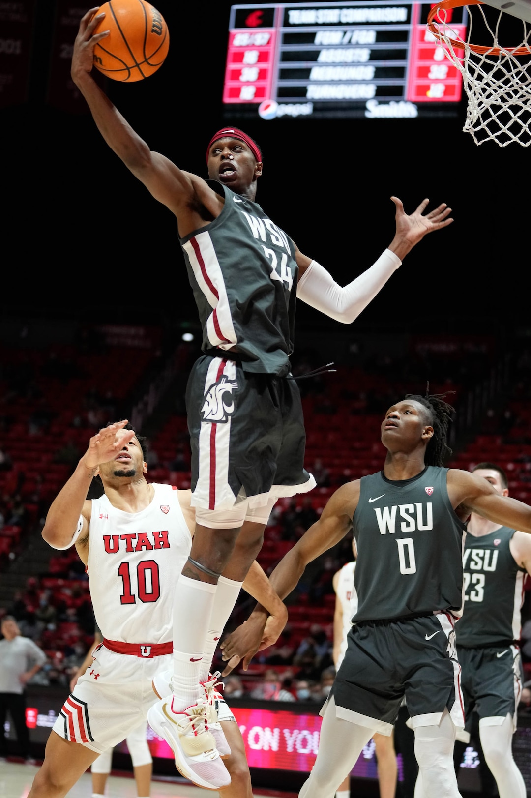 (Francisco Kjolseth | The Salt Lake Tribune) Washington State Cougars guard Noah Williams (24) wins the rebound over Utah in game action during an NCAA college basketball game at the Jon M.Huntsman Center, on Saturday, Jan. 8, 2022. Utah lost 61-77.