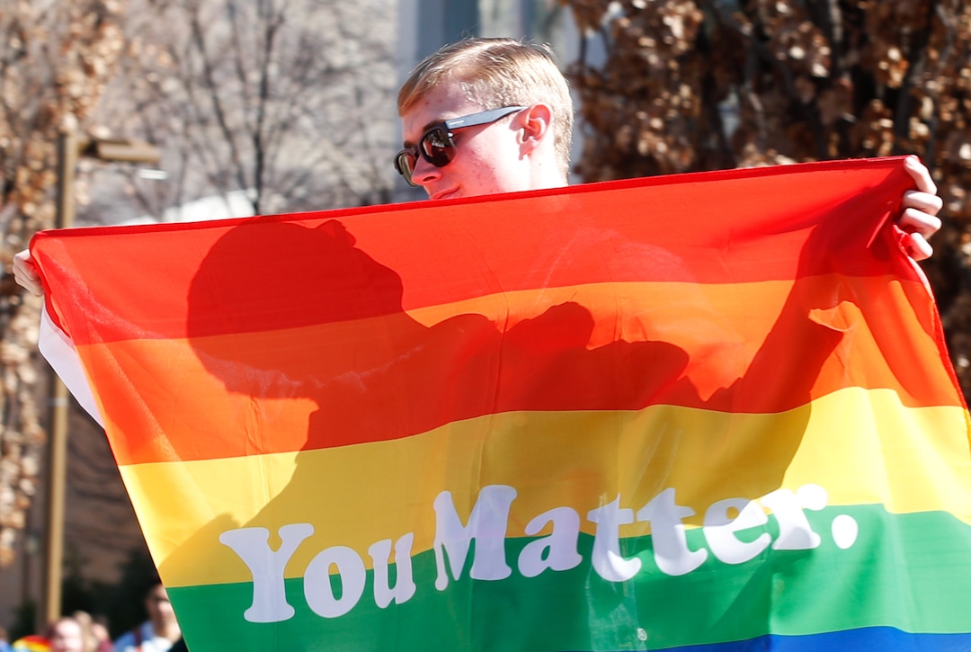 (George Frey  |  special to The Salt Lake Tribune) BYU students and others gather in front of the Ernest L. Wilkinson Student Center on the campus of Brigham Young University to protest BYUÕs rollback of a newly announced policy change on LGBTQ students on March 5, 2020 in Provo, Utah.