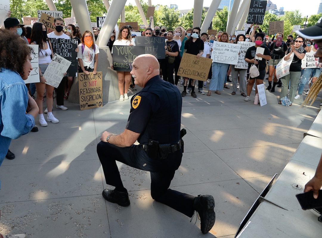 (Francisco Kjolseth  |  The Salt Lake Tribune) Salt Lake City Police Chief Mike Brown takes a knee as he shows his support of demonstrators protesting against police brutality on Wednesday, June 3, 2020, in downtown Salt Lake City, at the Salt Lake City Public Safety Building as the initially set 8 p.m. weeklong curfew was removed.