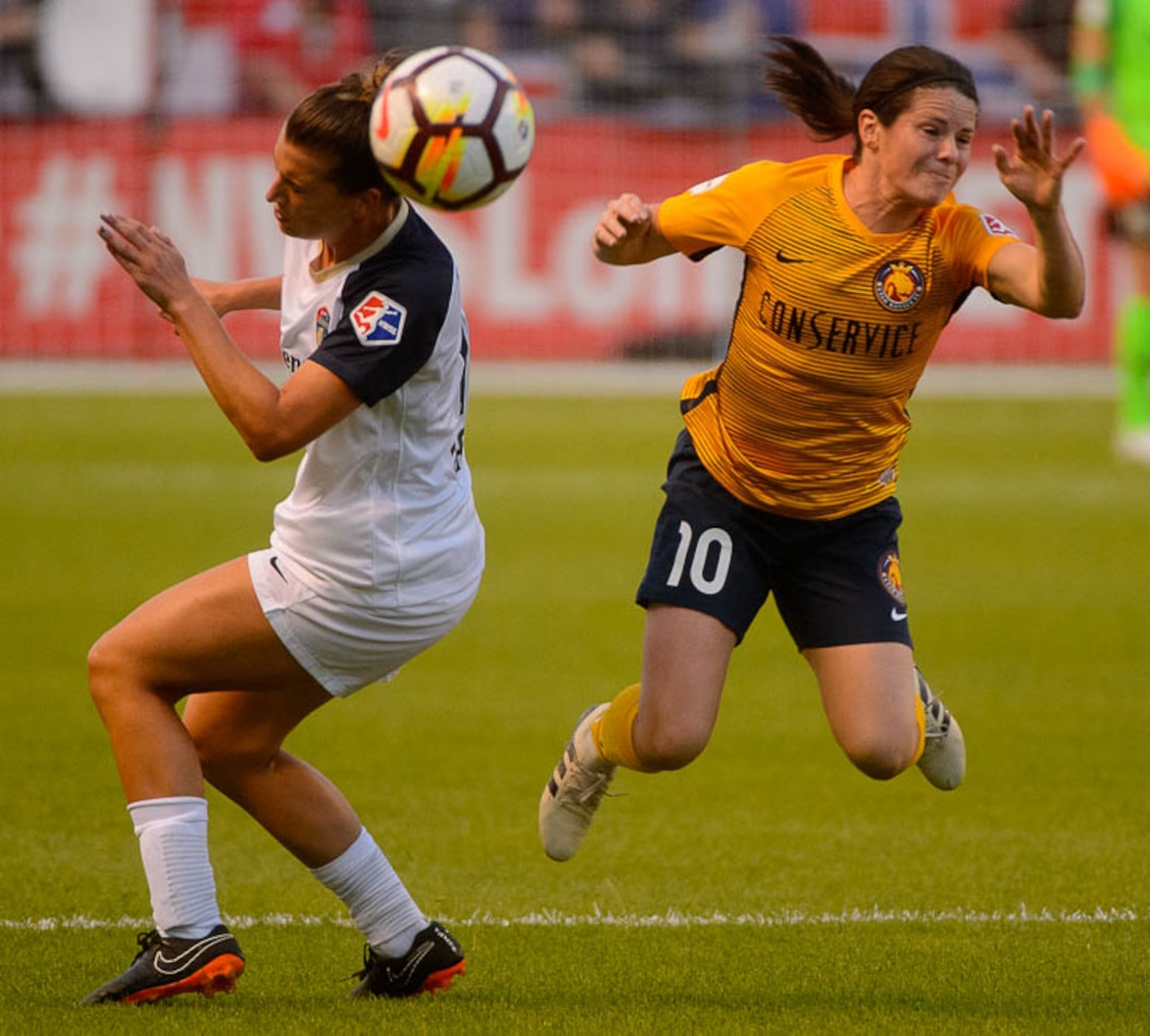(Trent Nelson | The Salt Lake Tribune)  Utah Royals FC host North Carolina Courage, NWSL soccer at Rio Tinto Stadium in Sandy, Friday July 20, 2018. Utah Royals FC midfielder Diana Matheson (10) goes around North Carolina's Cari Roccaro.