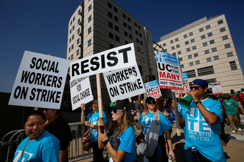 (Damian Dovarganes | The Associated Press) Social workers rally outside the Ronald Reagan UCLA Medical Center in Los Angeles Tuesday, Oct. 23, 2018. About 15,000 medical workers started a three-day strike at five University of California medical centers amid a dispute over pay raises and job security, forcing the cancellation and rescheduling of thousands of surgeries and outpatient appointments, officials said.
