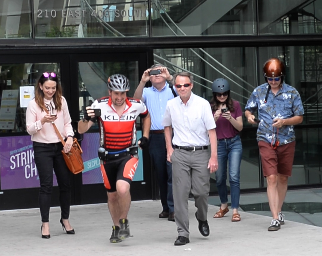(Rick Egan  |  The Salt Lake Tribune)       Salt Lake Tribune reporters and editors leave Library Square at the start of a race against colleagues in a transportation race from Library Square to the Tribune building at the Gateway on Thursday, Aug. 2, 2018. 