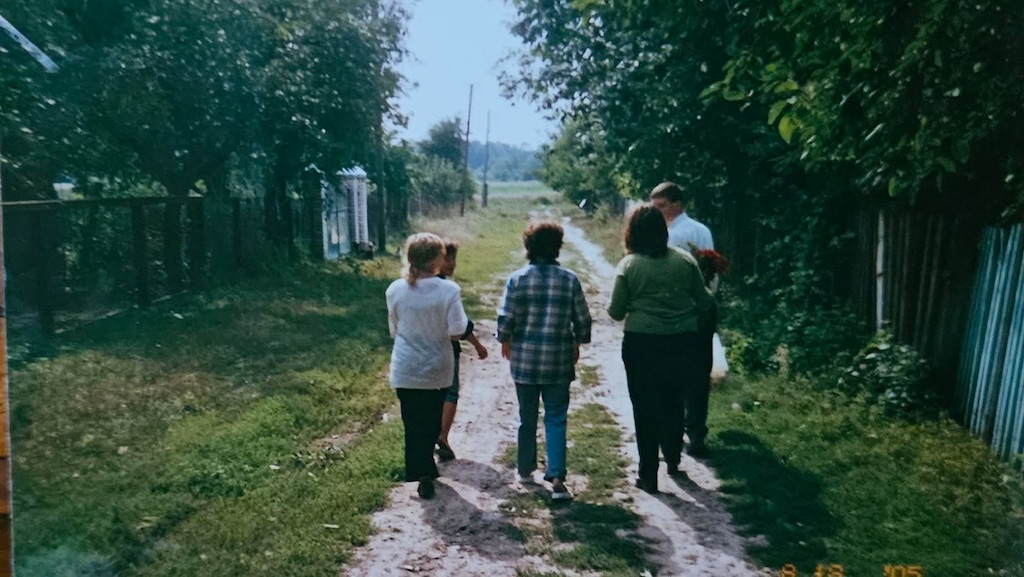 (Eli McCann) Then-missionary Eli McCann walks with villagers in Medvezhe Vushko, Ukraine.