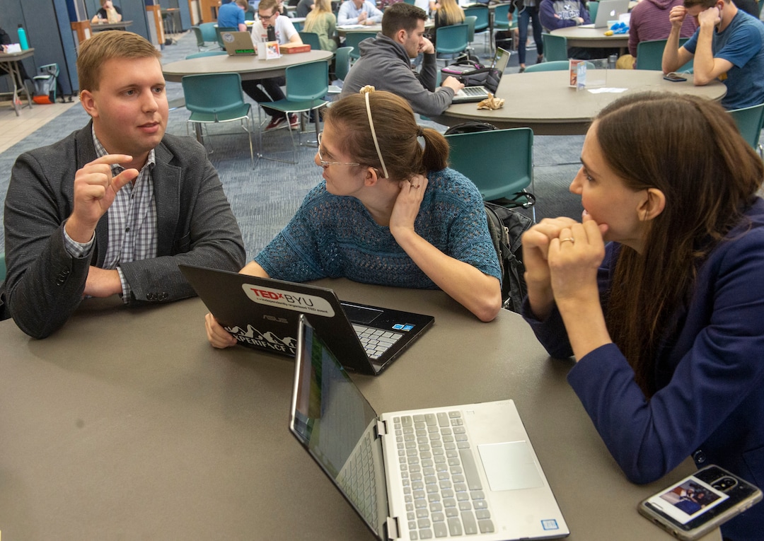 (Rick Egan  |  The Salt Lake Tribune)     Caleb Stewart, talks to Megan McLaws, and Kendra Muller about accessibility issues on BYU campus, Wednesday, April 17, 2019.