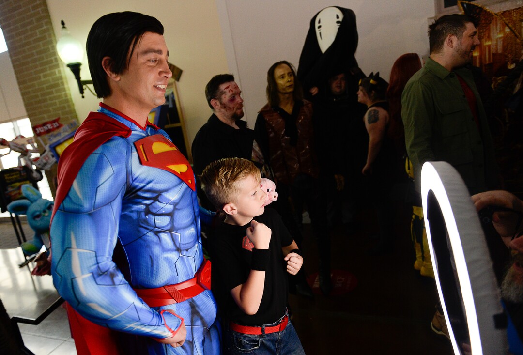 (Francisco Kjolseth  |  The Salt Lake Tribune)  Matt Raines and his son Andon, 10, pose for a photograph during FanX's twice-annual "press conference," drawing cosplayers to Megaplex Jordan Commons in Sandy on Wed. June 12, 2019, for the announcement of the event's celebrity visitors.