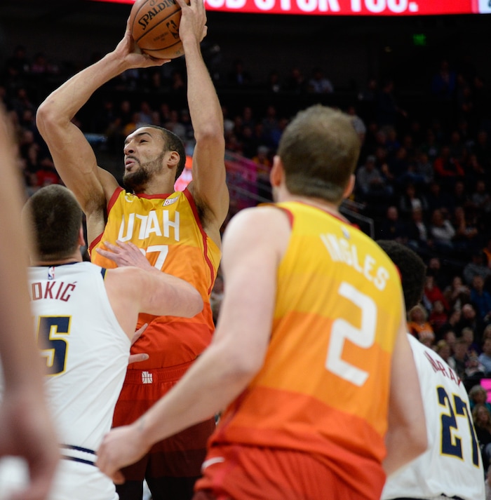 (Francisco Kjolseth  |  The Salt Lake Tribune)  Utah Jazz center Rudy Gobert (27) goes up for a shot as the Utah Jazz host the Denver Nuggets in their NBA game at Vivint Smart Home Arena Tuesday, April 9, 2019, in Salt Lake City.