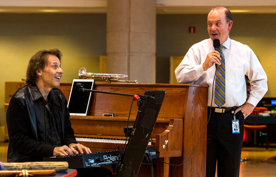 (Rick Egan  |  The Salt Lake Tribune)    Kurt Bestor sings along with hospital administrator,Kevin Martin, during an intimate one-man show at Shriners' Hospital, Tuesday, Nov. 19, 2019.