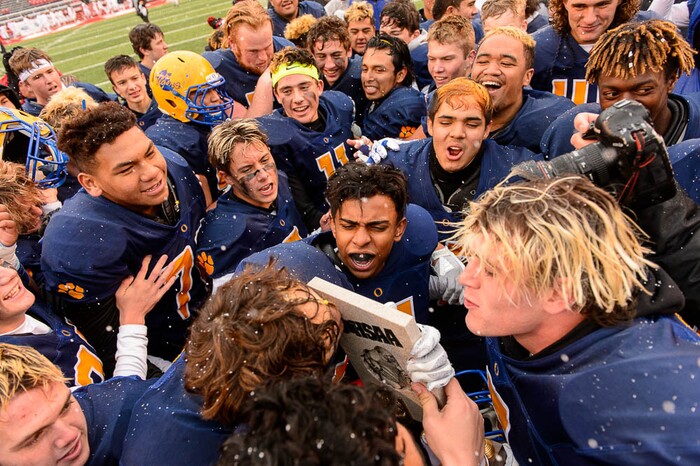 (Trent Nelson | The Salt Lake Tribune)  Orem players celebrate the win over Mountain Crest in the Class 4A High School State Football Championship game in Salt Lake City, Friday November 17, 2017.