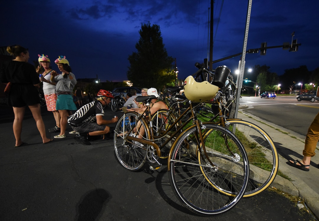 (Francisco Kjolseth  |  The Salt Lake Tribune)  A large group of cyclist gathers on the corner of 9th and 9th at 9pm in Salt Lake City on Thursday, July 26, 2018, for the weekly ride that has become known as the 999 Ride. The inclusive, all-welcoming slow casual social ride happens year round on Thursday nights, with riders often pedaling into the early morning hours. Newly released video shows rider Cameron Hooyer being struck and killed by a FrontRunner train at a downtown railroad crossing during last weeks ride when the 22-year-old failed to stop or heed the warning signals before crossing the tracks during the group ride. 