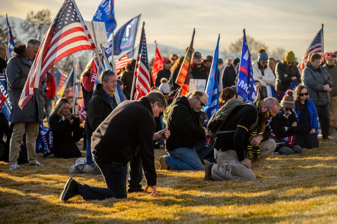 (Trent Nelson  |  The Salt Lake Tribune) Trump supporters kneel in prayer at the State Capitol in Salt Lake City on Wednesday, Jan. 6, 2021.