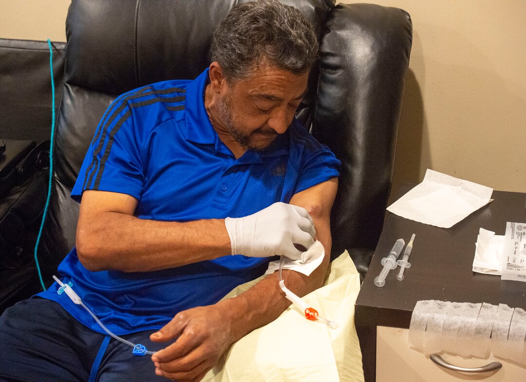 (Rick Egan  |  The Salt Lake Tribune)     Raul Gutierrez goes through the steps to setup his machine, as an in-home dialysis patient. Thursday, Sept. 5, 2019.