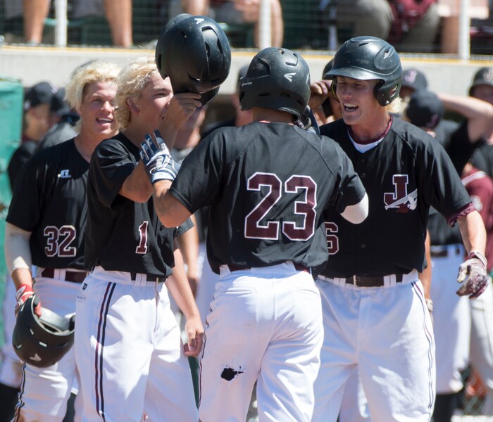 (Rick Egan  |  The Salt Lake Tribune)   Jordan High congratulates Jordan Bachman after ht hit a home run for the Beet diggers, in the 5A state baseball championship game, at UVU in Orem, Friday, May 25, 2018.