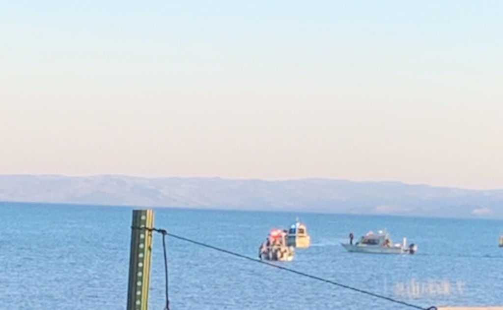 (Photo courtesy of Suzanne Paylor) Search and rescue crews look for a man's body on Bear Lake on Saturday, July 18, 2020.