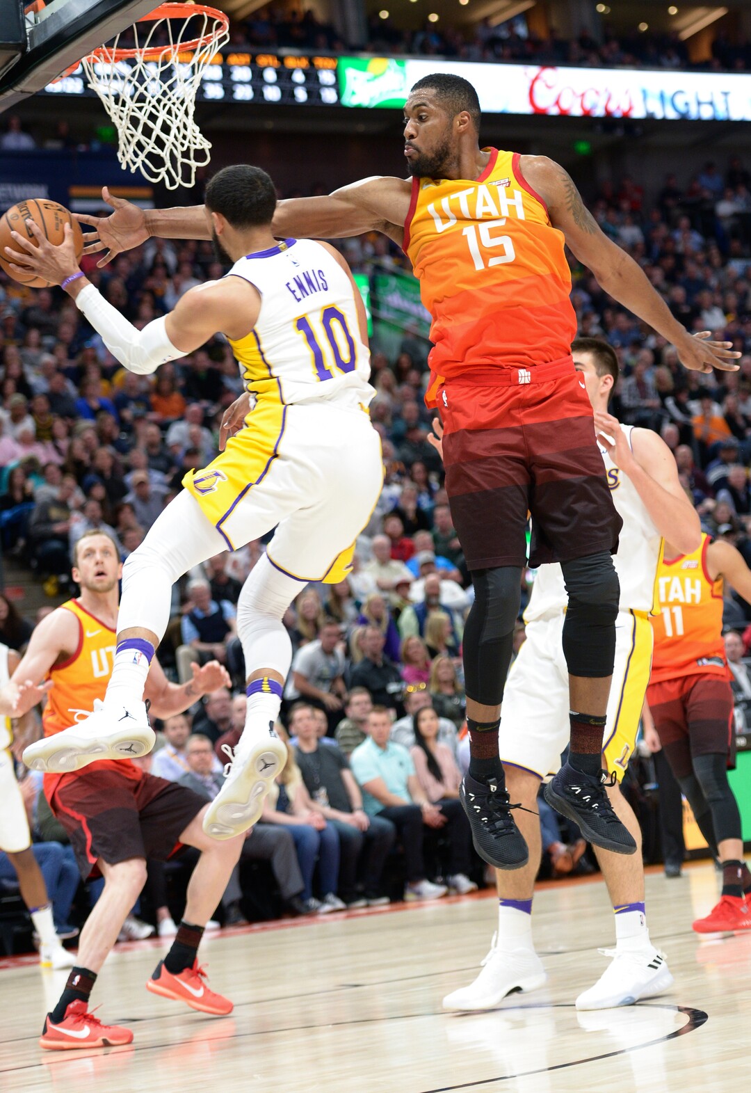 (Leah Hogsten  |  The Salt Lake Tribune)  Utah Jazz forward Derrick Favors (15) tries to block Los Angeles Lakers guard Tyler Ennis (10).  The Utah Jazz defeated the Los Angeles Lakers 117-110 at Vivint Smart Home Arena Tuesday, April 3, 2018