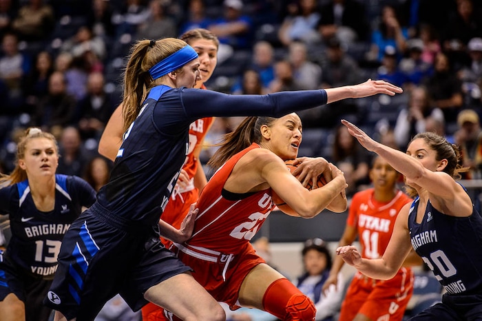 (Trent Nelson | The Salt Lake Tribune)  Utah Utes guard/forward Daneesha Provo (23) defended by Brigham Young Cougars center Sara Hamson (22) and Brigham Young Cougars guard Cassie Broadhead Devashraye (20) as BYU hosts Utah, NCAA women's basketball in Provo, Saturday December 9, 2017.