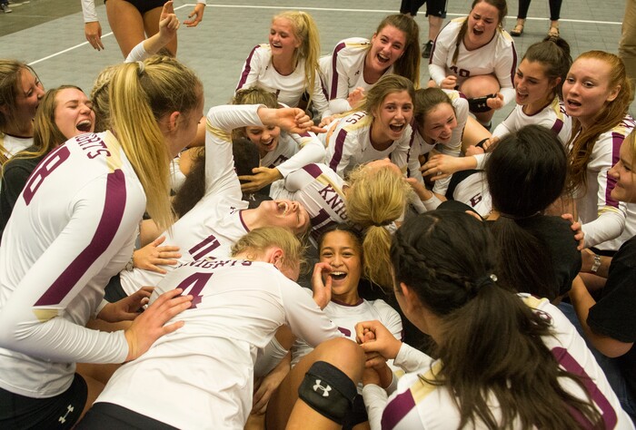 (Rick Egan  |  The Salt Lake Tribune)    The Lone Peak Knights celebrate their win over the Pleasant Grove Vikings, for the 6A volleyball championship, at Utah Valley University, Saturday, November 4, 2017.