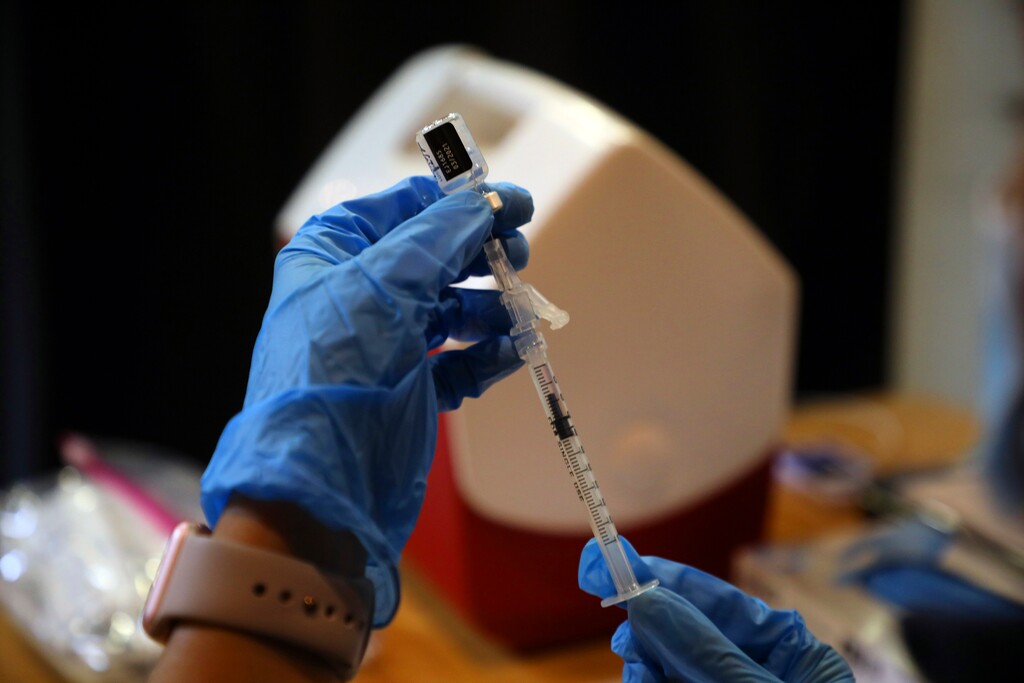 (Jim Wilson | The New York Times)

A syringe is filled with a dose of the Pfizer-BioNTech COVID-19 vaccine at a vaccine center in Rohnert Park, Calif., Jan. 27, 2021.