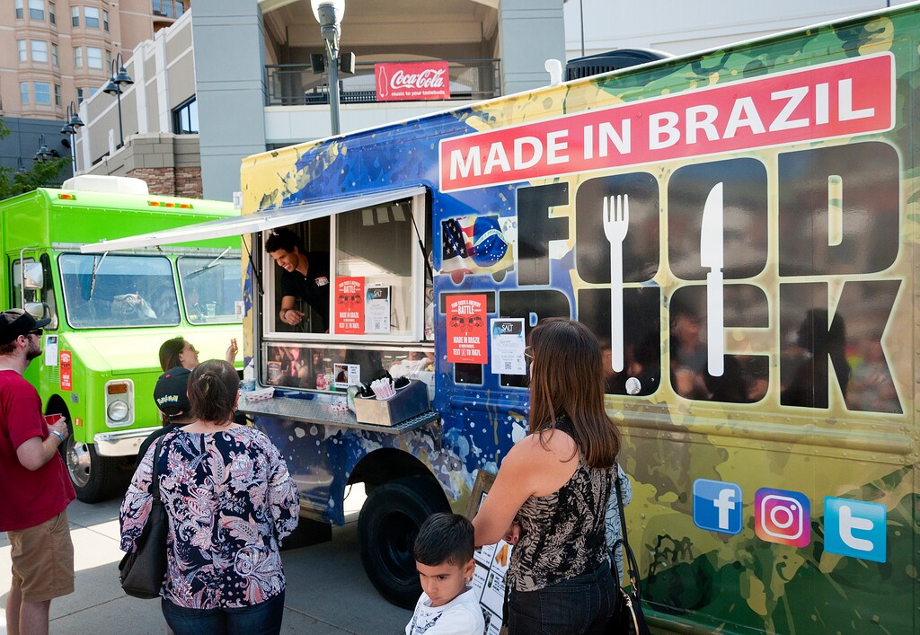 (Michael Mangum  |  Special to the Tribune)  Patrons line up at the Made in Brazil truck during the Food Truck & Brewery Battle at The Gateway in Salt Lake City on Saturday, Aug. 12, 2017.