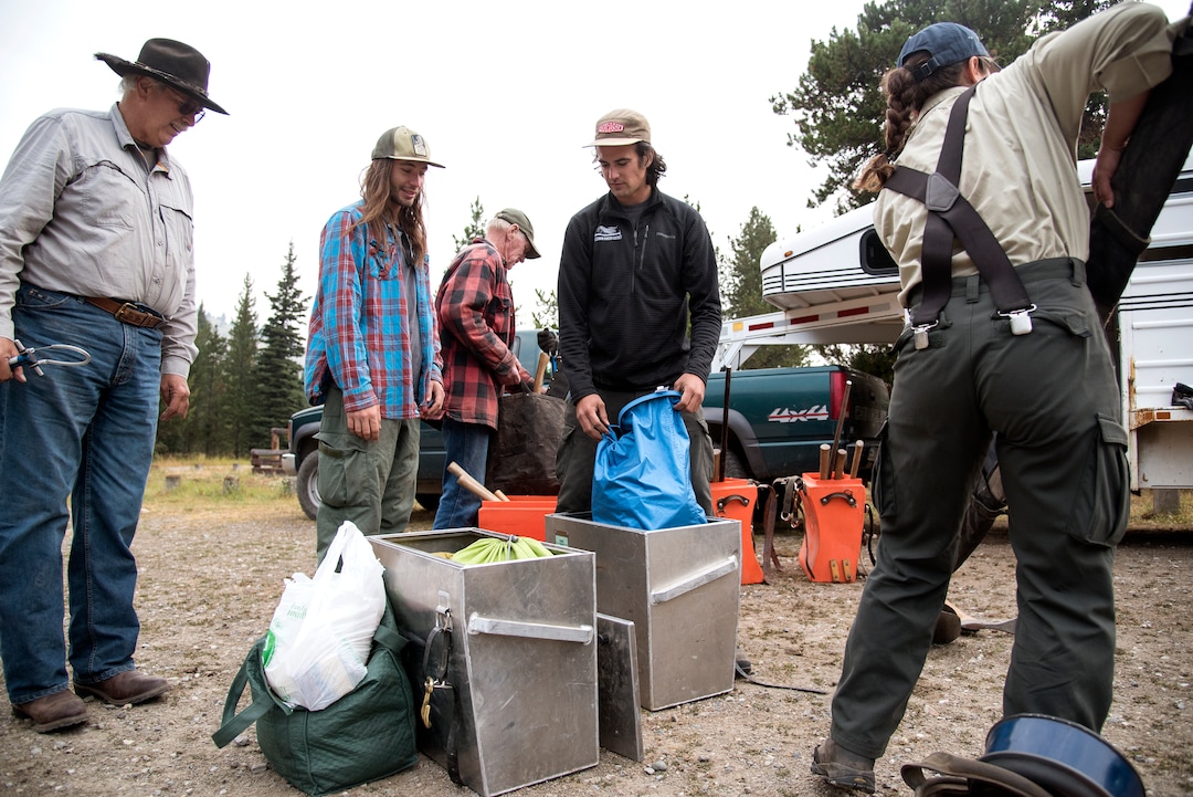 (Rachel Leathe  |  Bozeman Daily Chronicle) From left, Dan Marsh, Rich Inman, Larry Thomas, Patrick Rooney and Amanda "Lulu" Herrera pack up their gear before embarking on an eight-day backpacking trip into the Lee Metcalf Wilderness Area. They are part of a U.S. Forest Service trail crew whose job is to repair trails and bridges in the backcountry. 