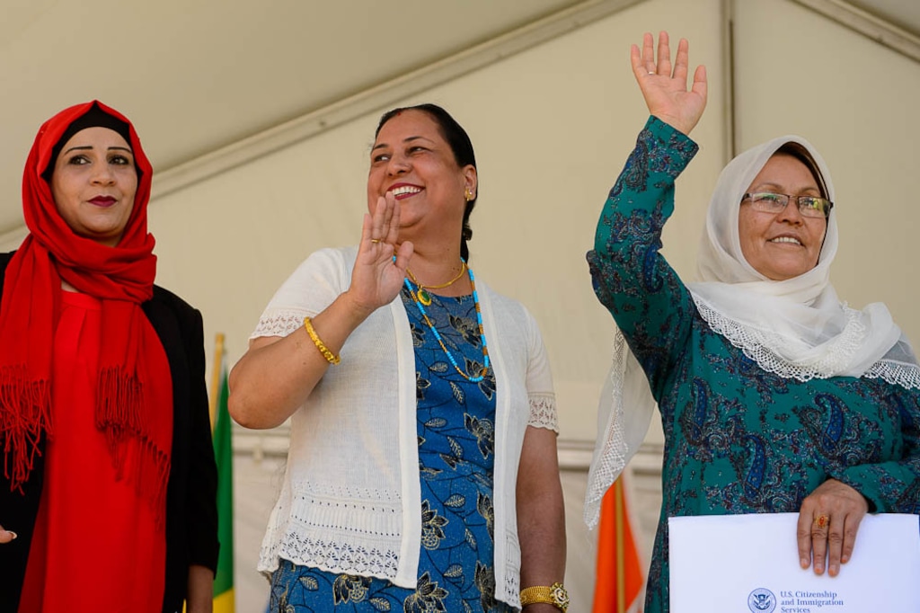 (Trent Nelson | Tribune file photo)
New citizens take the Oath of Allegiance at World Refugee Day in Salt Lake City, Saturday June 23, 2018. The free community celebration and festival of activities, included live cultural entertainment, ethnic food, global market, and kids’ activities. From left, Rasha Talib Saad Maslookhi, Hemanta Kathayat, and Zakieh Zavari.