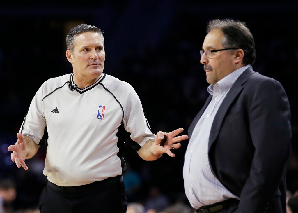 In this Feb. 21, 2016, photo, referee Monty McCutchen talks with Detroit Pistons head coach Stan Van Gundy during the first half of an NBA basketball game against the New Orleans Pelicans in Auburn Hills, Mich. McCutchen is now working in the league office and is tasked with trying to get referees and players to get along better. (AP Photo/Carlos Osorio)