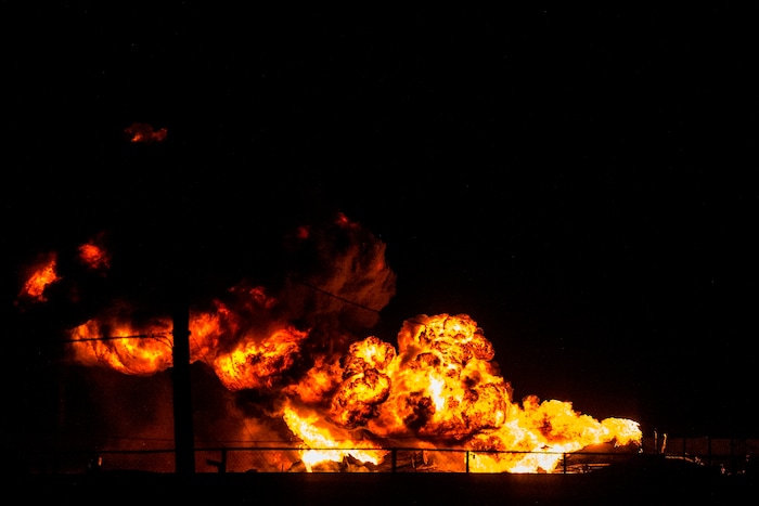 (Chris Detrick  |  The Salt Lake Tribune)  Firefighters attempt to put out a burning semitrailer that was hauling thousands of gallons of fuel on Interstate-15 in Midvale Thursday, January 18, 2018.   Lt. Todd Royce of the Utah Highway Patrol said the truck was southbound on the interstate at 7500 South at 7:20 p.m. when a tire caught fire, sending flames toward the tanks.
