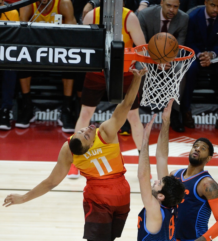 (Francisco Kjolseth  |  The Salt Lake Tribune)   Utah Jazz guard Dante Exum (11) reaches back on an attempt past the Thunder in the NBA game at Vivint Smart Home Arena Sat., Dec. 22, 2018, in Salt Lake City.