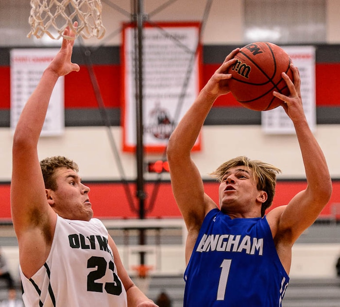 (Trent Nelson | The Salt Lake Tribune)  Bingham's Brayden Cosper shoots over Olympus's Harrison Creer as Olympus faces Bingham, high school boys' basketball at the Utah Elite 8 tournament in American Fork, Thursday December 7, 2017.