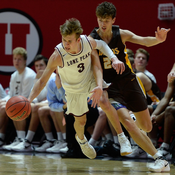 (Francisco Kjolseth  |  The Salt Lake Tribune)  Davis vs Lone Peak, 6A State high school basketball tournament at the Huntsman Center in Salt Lake City, Thursday March 1, 2018. Steven Ashworth (3) is pressured by Tyson Garff (21). 