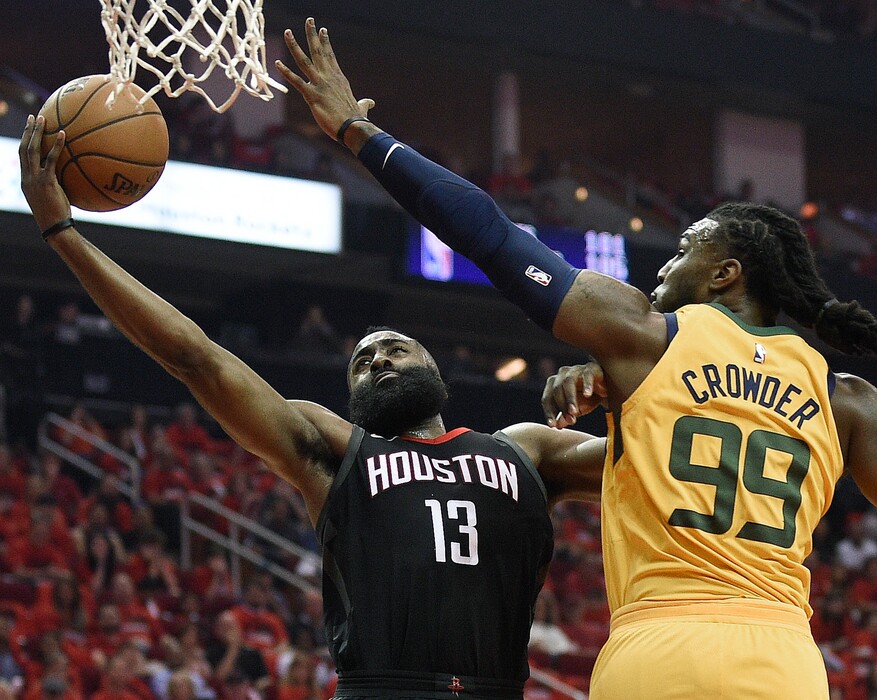 Houston Rockets guard James Harden (13) drives to the basket as Utah Jazz forward Jae Crowder defends during the first half in Game 1 of an NBA basketball second-round playoff series, Sunday, April 29, 2018, in Houston. (AP Photo/Eric Christian Smith)