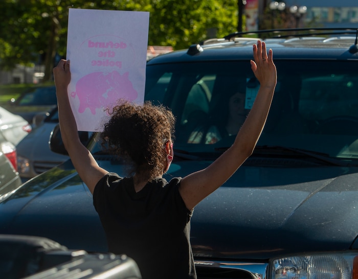 (Rick Egan  |  The Salt Lake Tribune) Hailee Hernandez stands in front of a car as protesters block traffic on 400 South in Salt Lake City during a demonstration for Bernardo Palacios-Carbajal on Monday, June 22, 2020.