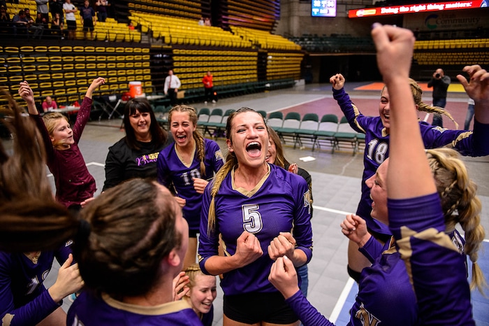 (Trent Nelson | The Salt Lake Tribune) North Summit players celebrate after defeating Enterprise in the 2A State Volleyball Championship game in Orem, Saturday October 28, 2017. At center is Hunter Vernon.