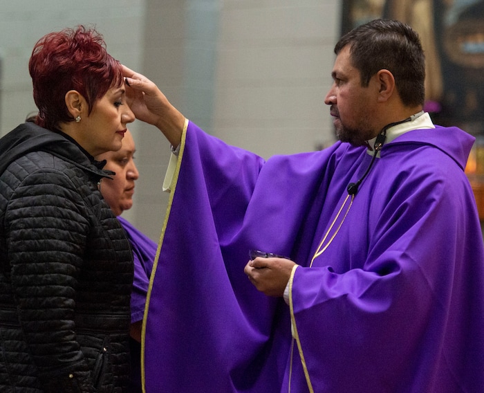 (Rick Egan  |  The Salt Lake Tribune)     Diana Rivas receives the ashes from the Rev. Jose Fidel Barrera-Cruz during Ash Wednesday Mass at Our Lady of Guadalupe Catholic Church in Salt Lake City on Wednesday, March 6, 2019.