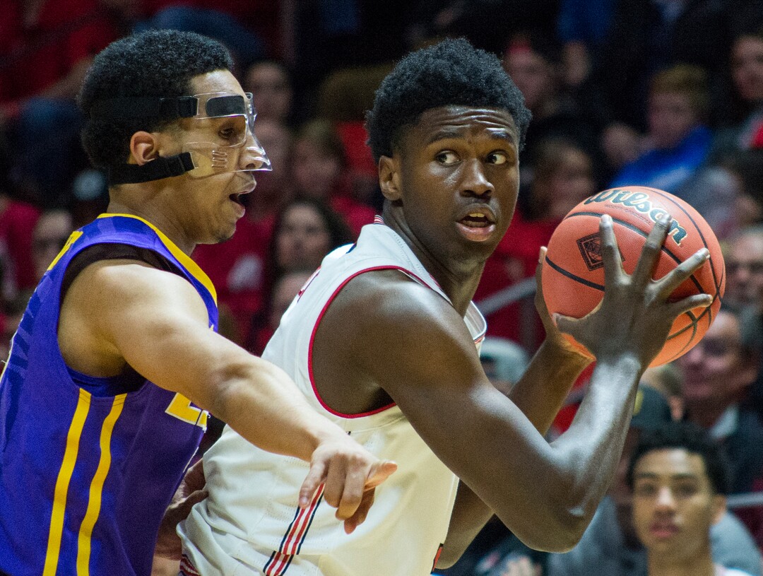 (Rick Egan  |  The Salt Lake Tribune)    Utah Utes guard Gabe Bealer (30) dribbles the ball, as LSU Tigers guard Randy Onwuasor (14) defends, in NIT playoff action between Utah Utes and LSU Tigers at the Jon M. Huntsman Center, Monday, March 19, 2018.