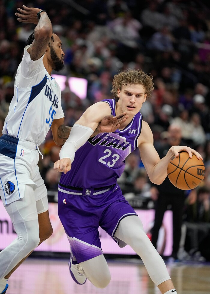 (Francisco Kjolseth  |  The Salt Lake Tribune) Dallas Mavericks forward Derrick Jones Jr. (55) pressures Utah Jazz forward Lauri Markkanen (23) during an NBA basketball game Monday, March 25, 2024, in Salt Lake City.