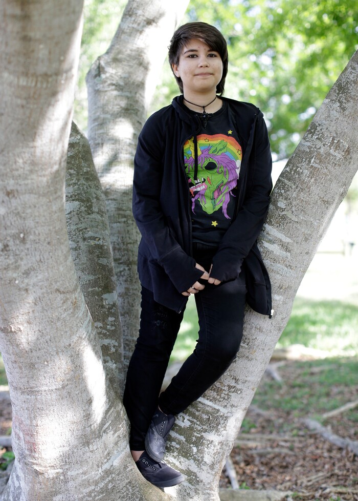 (Lynne Sladky | The Associated Press) In this Thursday, May 14, 2015 file photo, Alex Ramos, 13, who now goes by the name Theo Ramos, poses for a photograph in a park near his home in Homestead, Fla. “When you’re 10 years old, you really shouldn’t be worried about who you are,” Theo would say years later, in a moment of reflection. “You shouldn’t be having that existential question when you’re in fifth grade. You should be worried about homework and the fifth-grade dance coming up.”