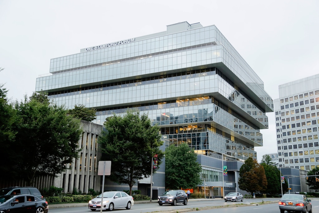 (Frank Franklin II | AP file photo) In this Sept. 12, 2019, file photo, cars pass Purdue Pharma headquarters in Stamford, Conn. Attorneys general representing nearly half the states and lawyers for more than 500 local governments on Friday, Oct. 4, 2019 blasted the terms of OxyContin maker Purdue Pharma’s offer to settle thousands of lawsuits over the toll of the nation’s opioids crisis.