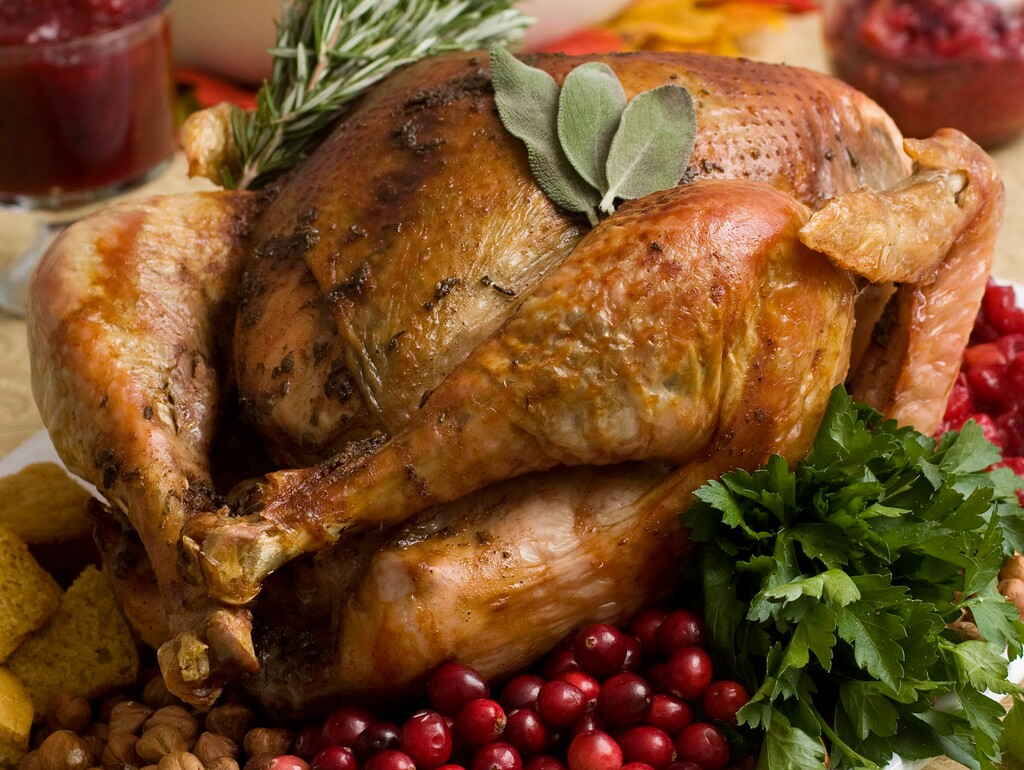 (Larry Crowe | AP file photo) This Nov. 2, 2009, file photo shows a Thanksgiving turkey in Concord, N.H. Food safety experts say raw turkeys shouldn’t be rinsed, since that can spread harmful bacteria. Cooking should kill any germs. But bacteria can still spread in other ways, so washing and sanitizing hands and surfaces is still important.
