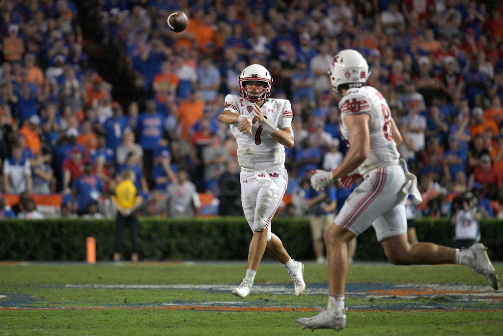 (Phelan M. Ebenhack | AP) Utah quarterback Cameron Rising (7) throws a pass to tight end Dalton Kincaid, front, during the second half of an NCAA college football game against Florida, Saturday, Sept. 3, 2022, in Gainesville, Fla.