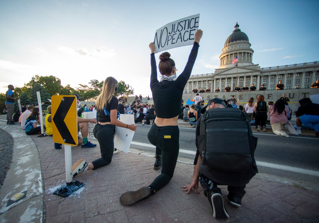 (Rick Egan  |  The Salt Lake Tribune) Protesters kneel down in silence for 9 minutes in remembrance of George Floyd as they gather at the State Capitol for a demonstration, Wednesday, June 3, 2020.