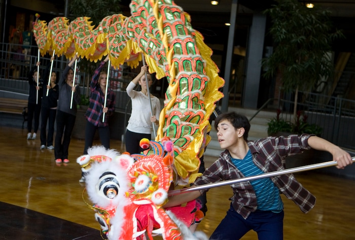 (Keith Johnson | The Salt Lake Tribune file photo) Stephen Nakagawa and other dancers from Ballet West 2 rehearse with a 36-foot dragon at Trolley Square in Salt Lake City in November 2013. The dragon was added that year as a new element in Ballet West's production of "The Nutcracker."