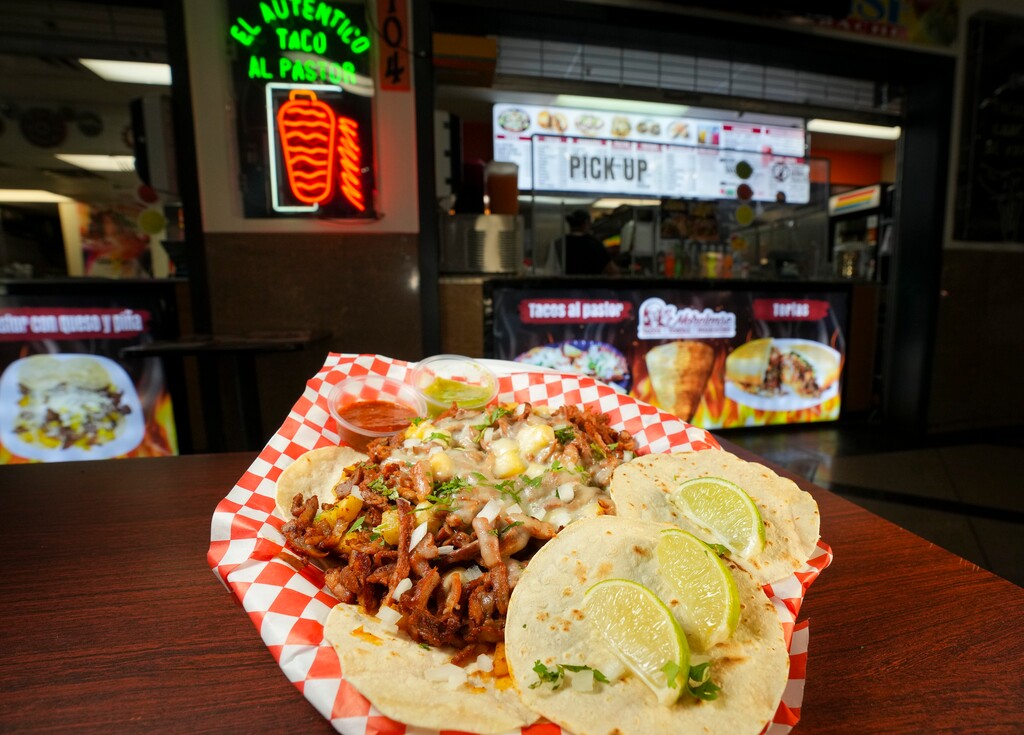 (Bethany Baker  |  The Salt Lake Tribune) A plate of pastor con queso y pina sits on a table at Tortas Y Jugos El Morelense, Inc. in Salt Lake City on Aug. 1, 2024.