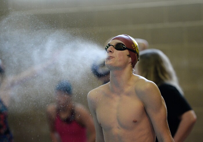 (Francisco Kjolseth  |  The Salt Lake Tribune)  Matt Runnells of Mnt. View performs his ritualistic pre race water blow before his Men 200 Yard IM at the high school swimming 4A State Championships in Bountiful, Friday February 9, 2018.
