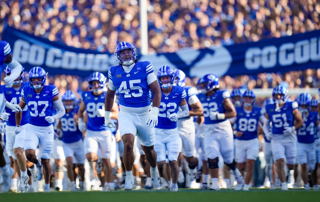 (Francisco Kjolseth | The Salt Lake Tribune) BYU players run onto the field for their NCAA college football game against Utah Tech, Saturday, Sept. 5, 2026, at LaVell Edwards Stadium in Provo.