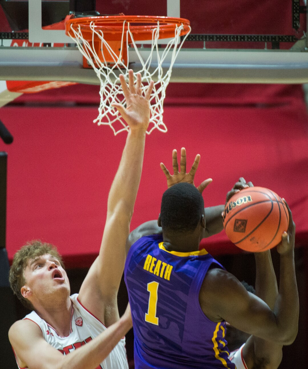 (Rick Egan  |  The Salt Lake Tribune)    LSU Tigers forward Duop Reath (1) shoots, as Utah Utes forward Jayce Johnson (34) defends, in NIT playoff action between Utah Utes and LSU Tigers at the Jon M. Huntsman Center, Monday, March 19, 2018.