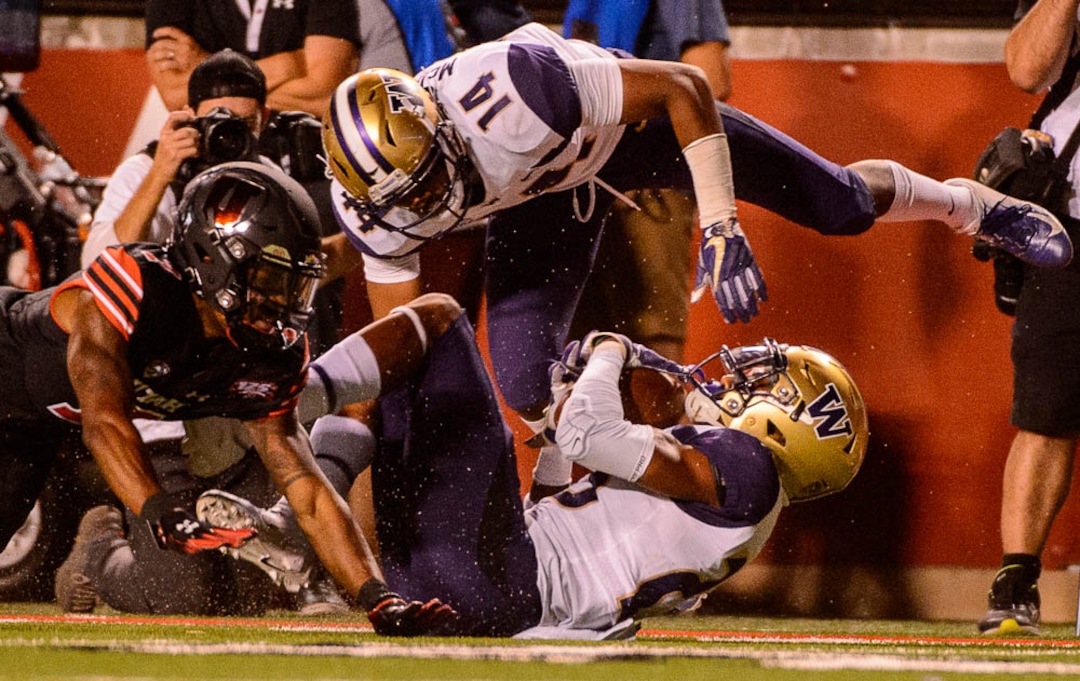 (Trent Nelson | The Salt Lake Tribune)  Washington Huskies defensive back Jordan Miller (23) intercepts the ball with seconds left in the first half as the University of Utah hosts Washington at Rice-Eccles Stadium in Salt Lake City, Saturday Sept. 15, 2018.